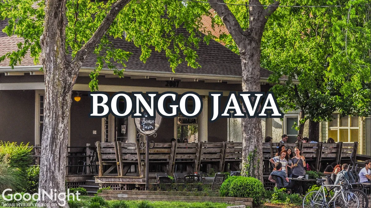An outdoor seating area in front of Bongo Java, a popular local coffeehouse, with people chatting, sipping coffee, and soaking up the lively street scene. The relaxed, communal vibe hints at fun group outings and the social culture just beyond the property.